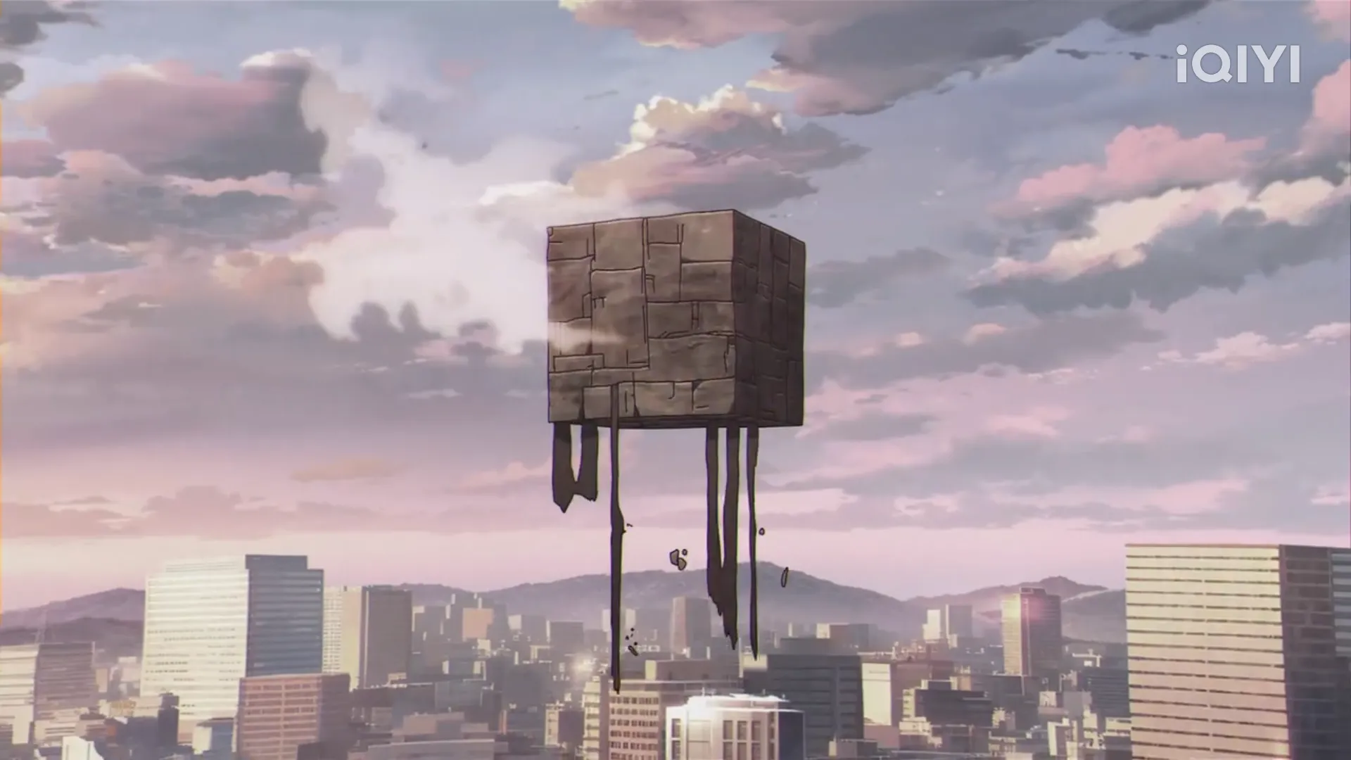 a cube with a city in the background